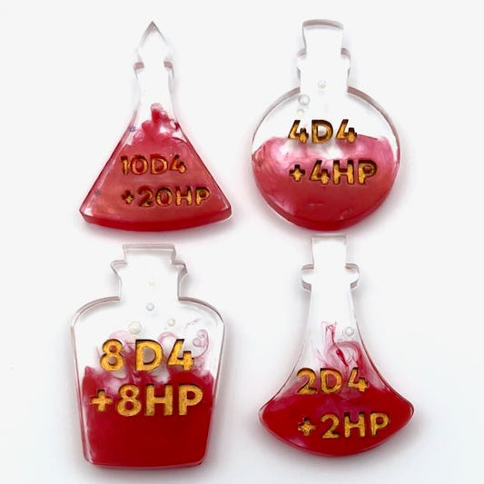 Set of 4 resin potion bottles with red alcohol ink colouring and gold lettering