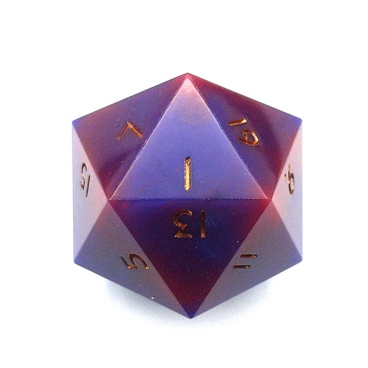 Purple through red opaque pearlescent minimalist D20 chonk with gold inking on the numbers