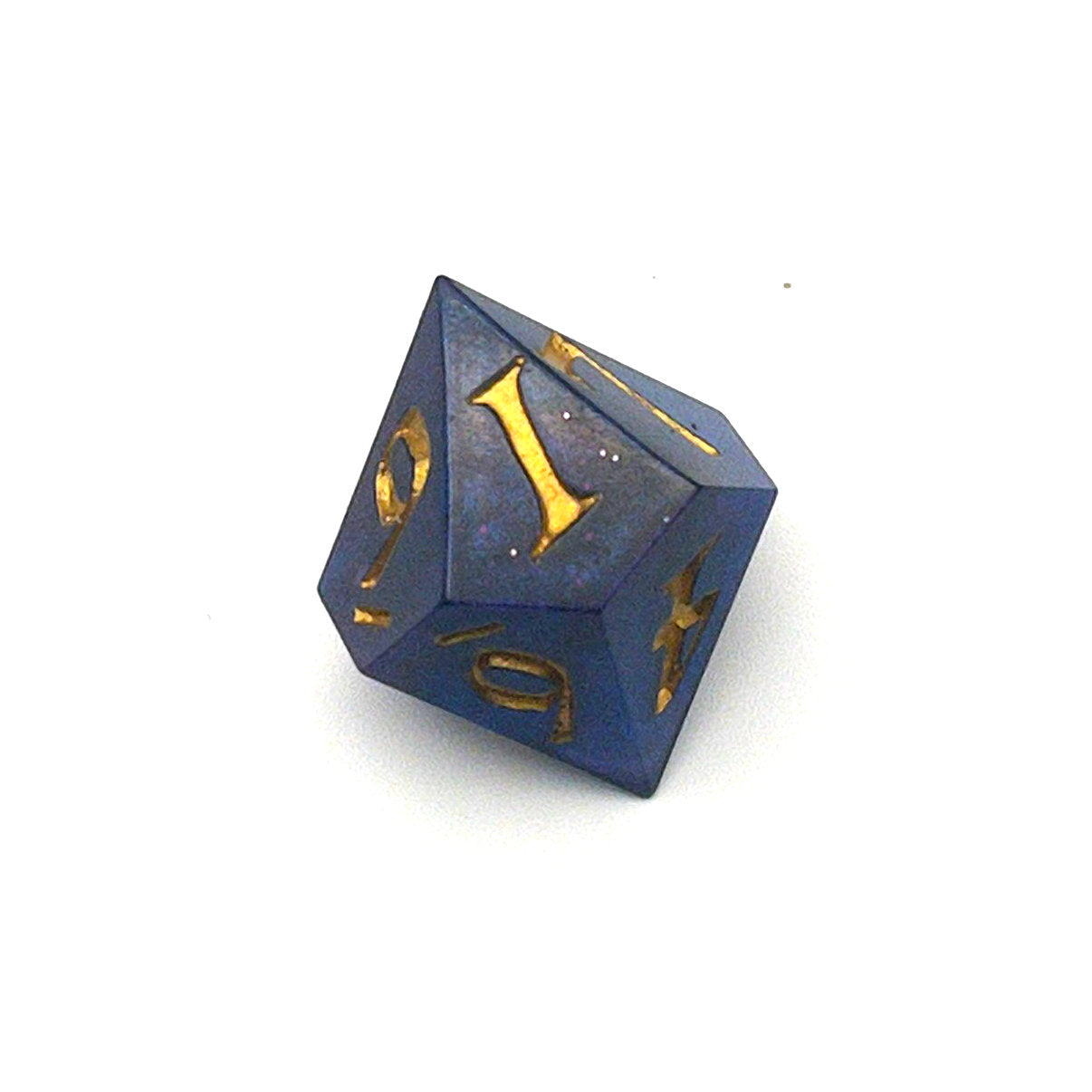D10 chonk dice showing the 1 face. The resin is coloured with pigment powders using black, blue and red. The die is inked in gold.