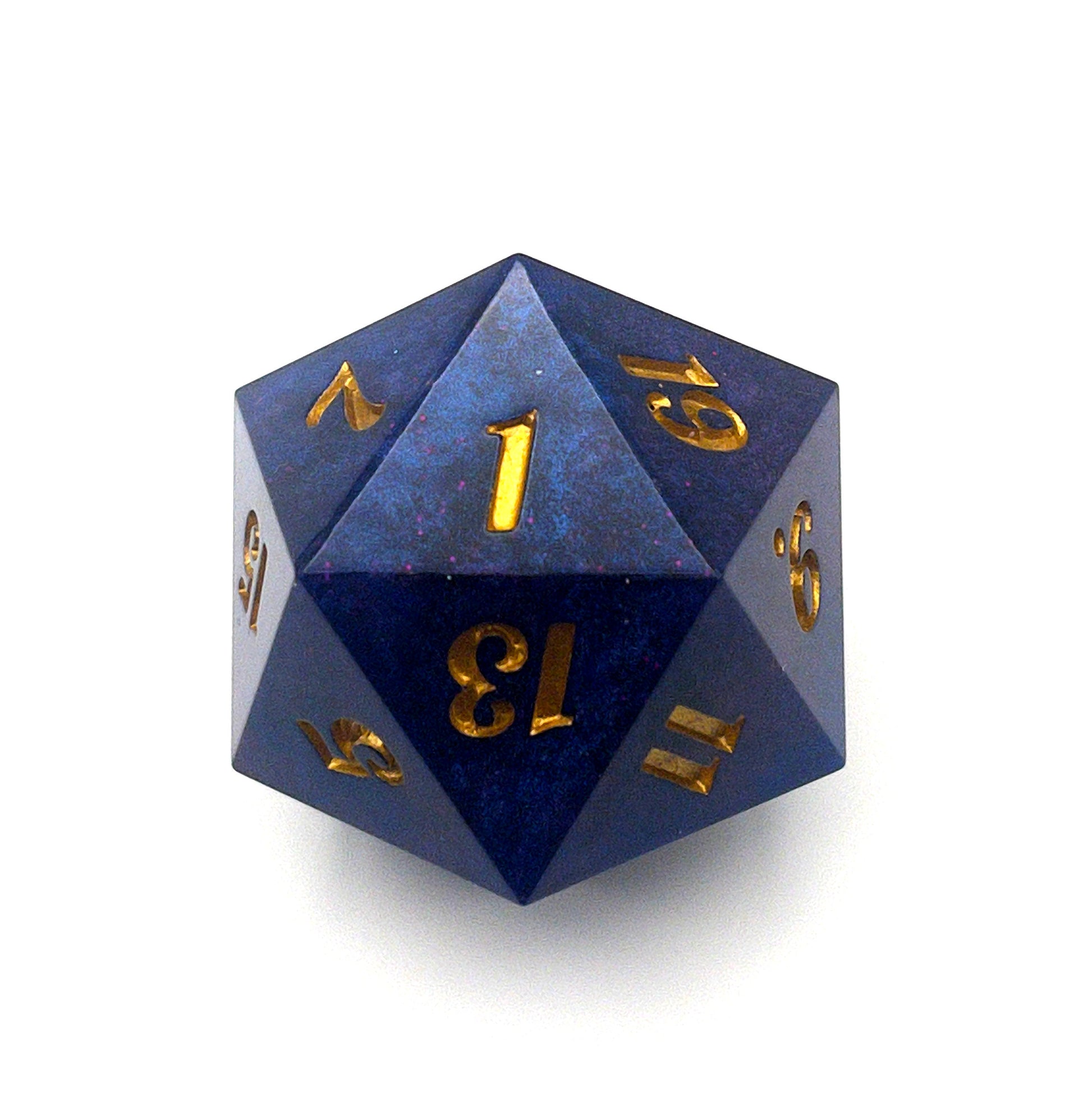 D20 chonk dice showing the 1 face. The resin is coloured with pigment powders using black, blue and red. The die is inked in gold.