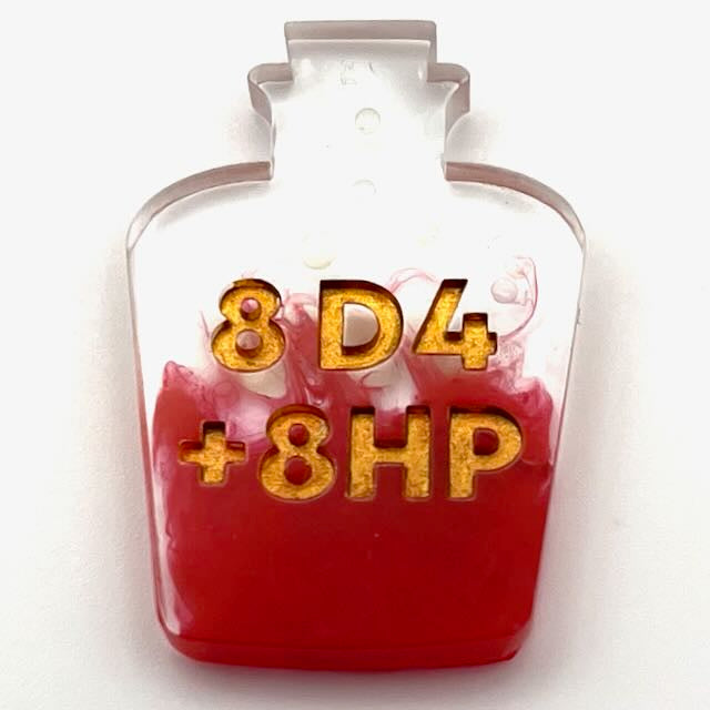 Resin potion bottle with red alcohol ink colouring and gold lettering