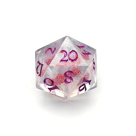 D20 resin dice. Resin is transparent with translucent glitter suspended inside and a red 3D printed hair bow. These are inked in colour-shifting pink pigment