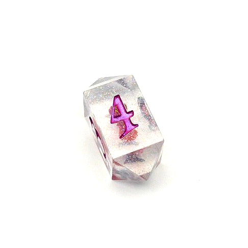 D4 resin dice. Resin is transparent with translucent glitter suspended inside and a red 3D printed hair bow. These are inked in colour-shifting 