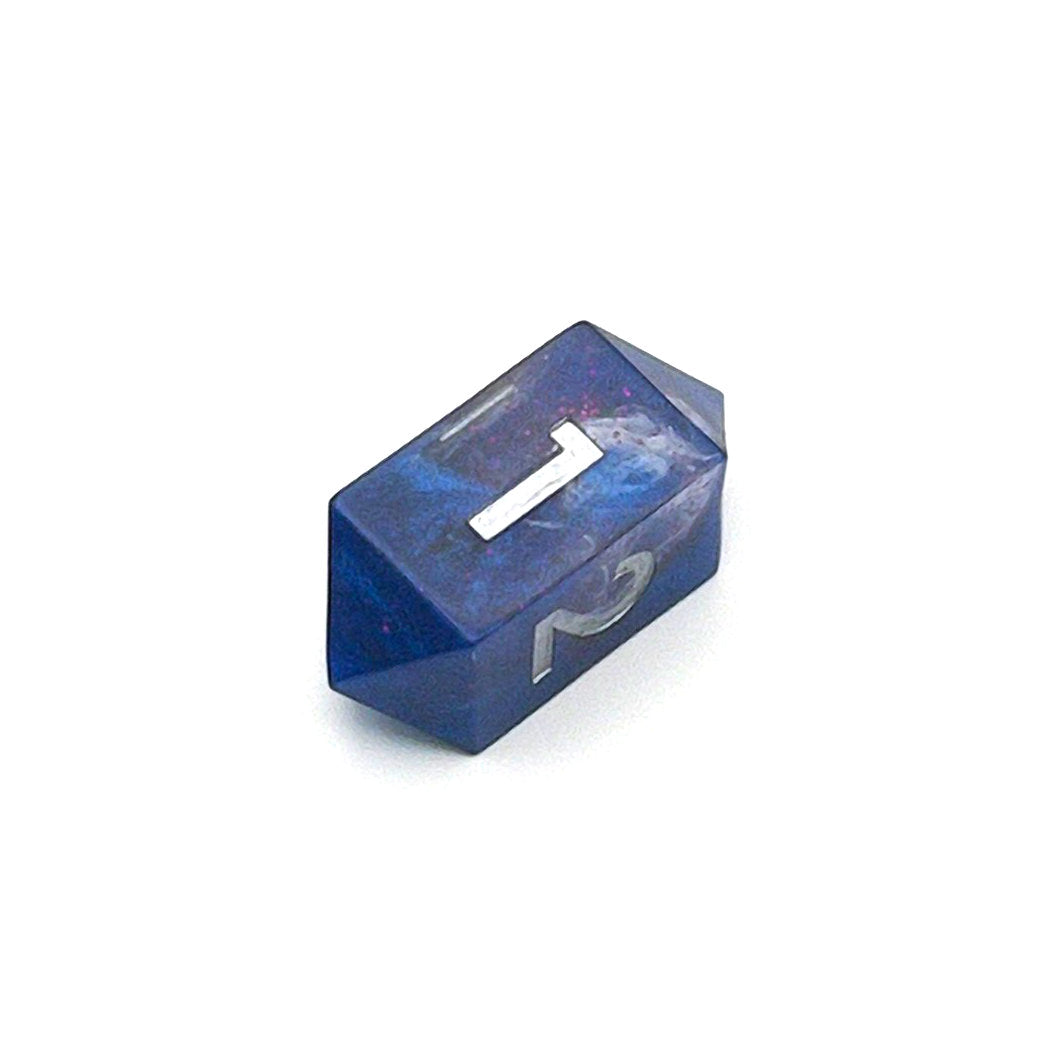 D4 TTRPG resin die, opaque blue in parts, with clear areas with white resin. Inked in silver