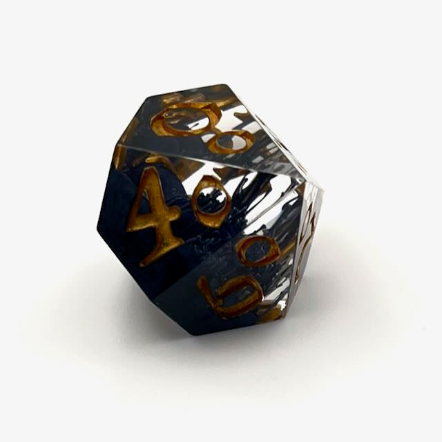 D100 TTRPG resin dice with gold inking. Clear and black resin