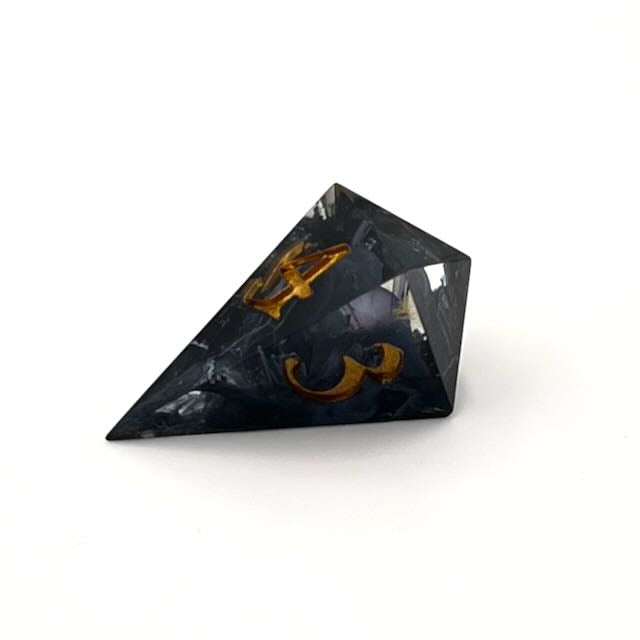D4 TTRPG resin dice with gold inking. Clear and black resin