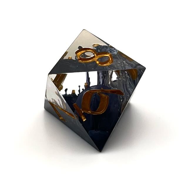 D8 TTRPG resin dice with gold inking. Clear and black resin