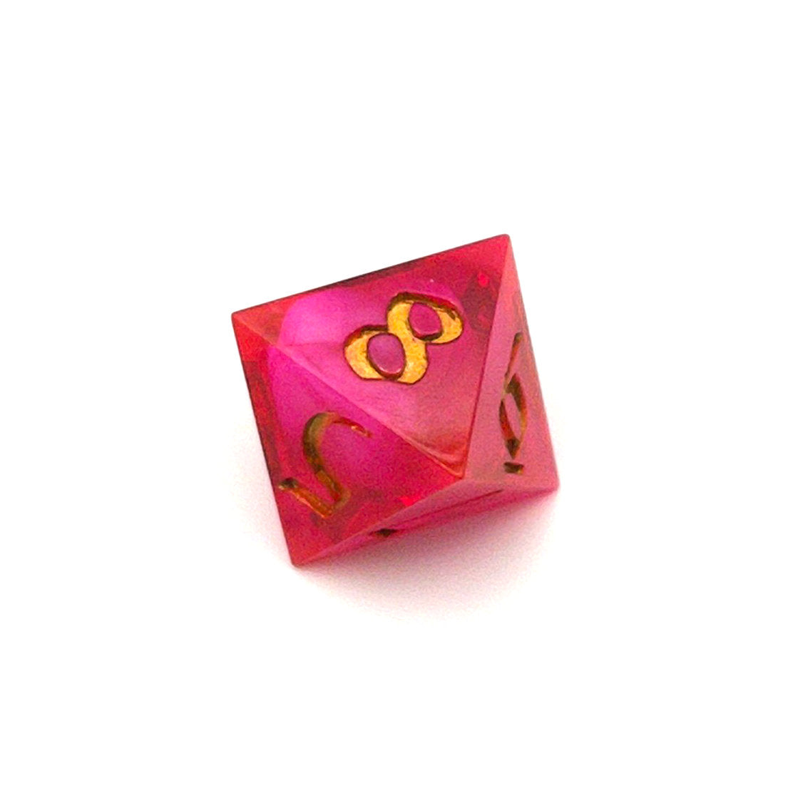 D8 semi-transparent resin die, coloured with red and pink dye, with a soft blur of resin coloured with Piñata Blanco Blanco white in the centre and inked in gold