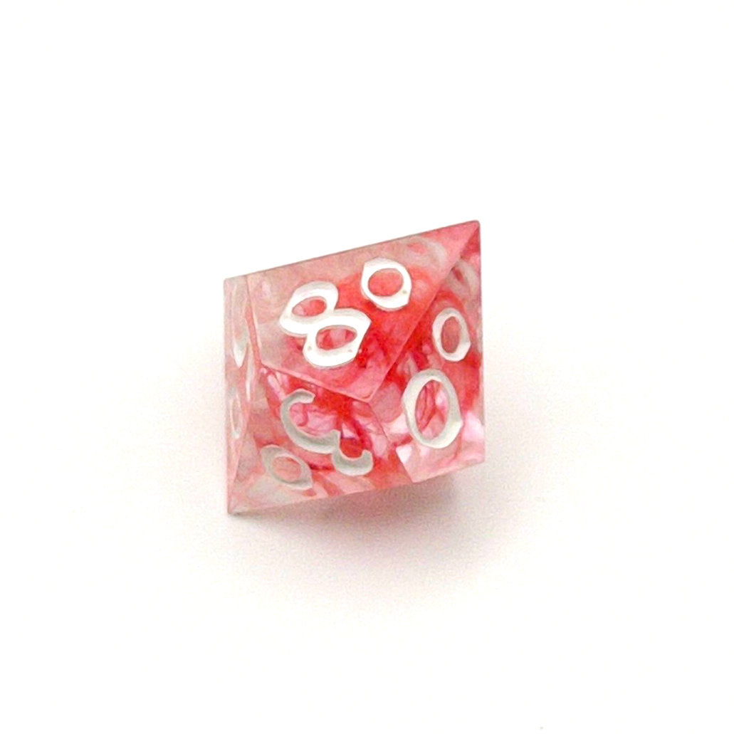 D100 TTRPG die. Transparent resin with a swirl of red dyed resin through the centre, known as 'Blood in the Water'. Inked in white