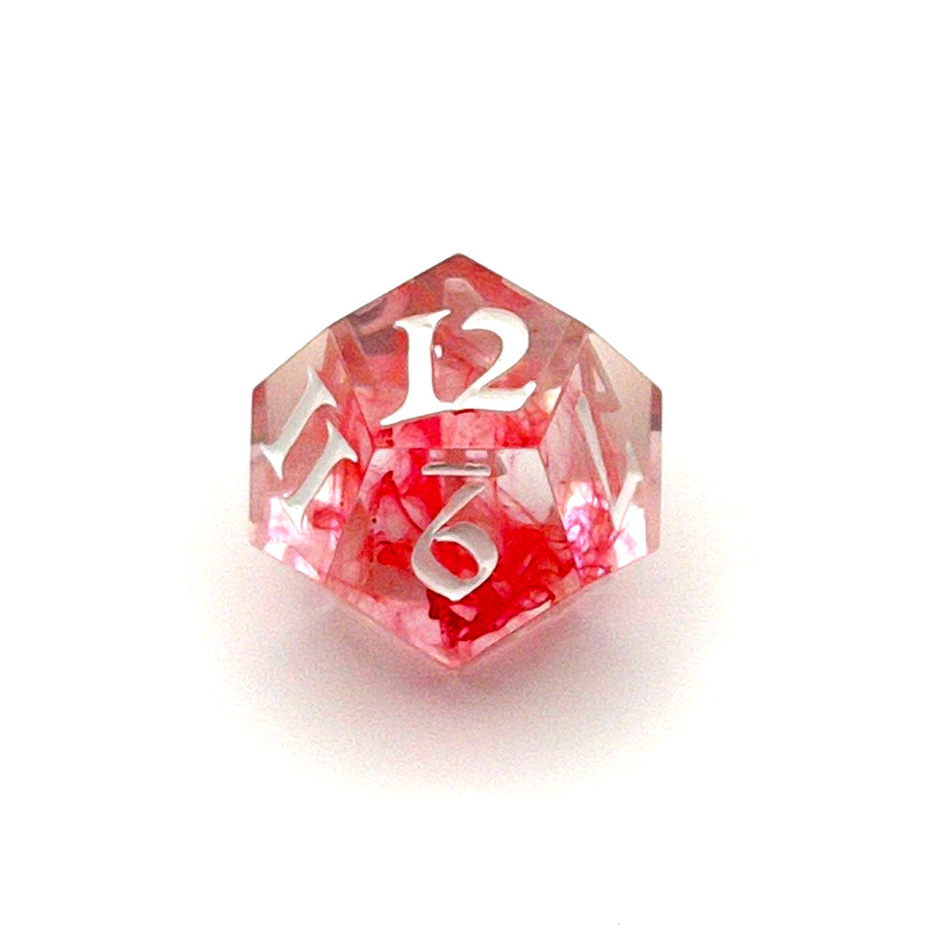 D12 TTRPG die. Transparent resin with a swirl of red dyed resin through the centre, known as 'Blood in the Water'. Inked in white