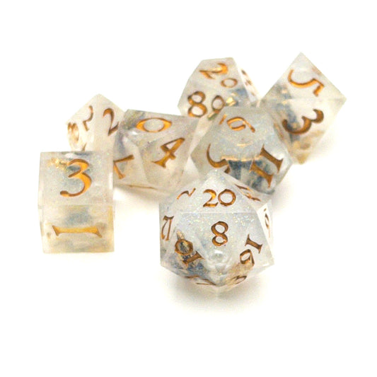 Full set of TTRPG dice, semi-transparent resin with translucent glitter and angel wing and pearl beads suspended inside. Inked in gold