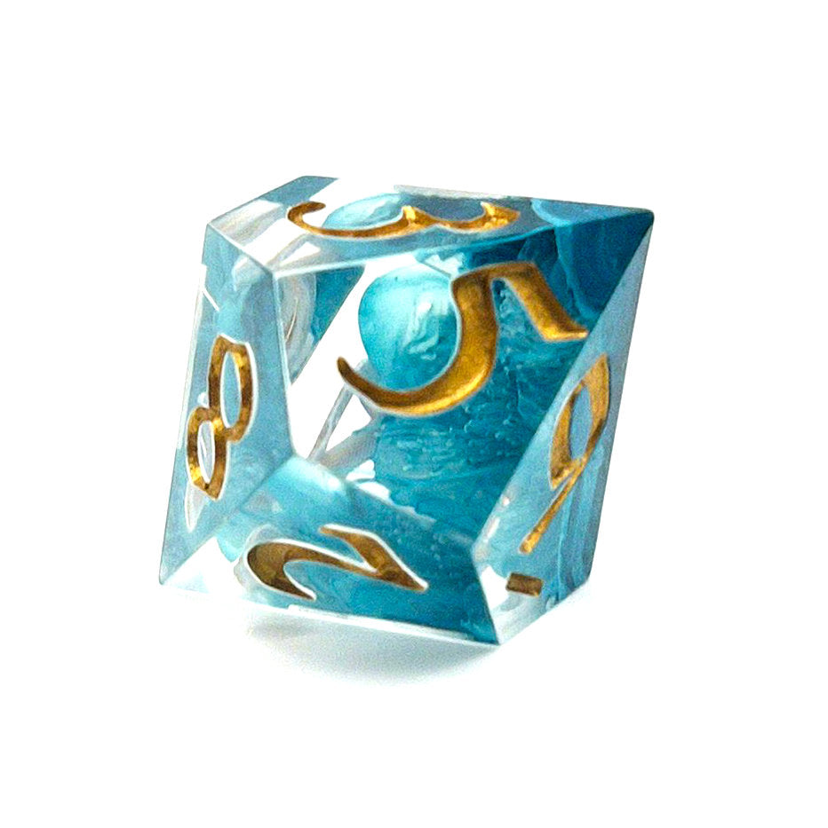 D10 TTRPG resin dice, petri-pour in white and Smurf blue, inked in Gold
