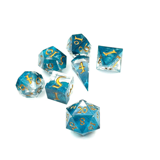 Full set of TTRPG resin dice, petri-pour in white and Smurf blue, inked in Gold