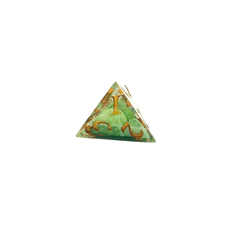 D4 TTRPG resin die, with green and white pigment cast into blanks and then shelled in clear resin and inked in Chromed Gold