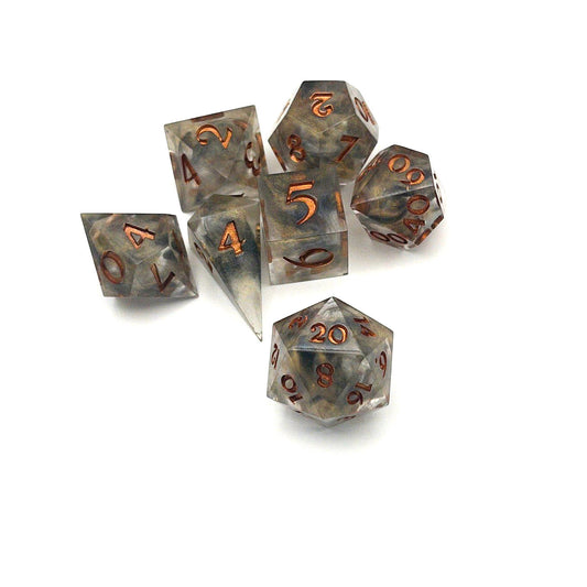 Full set of TTRPG resin dice using transparent black and gold dyes, inked in metallic copper paint