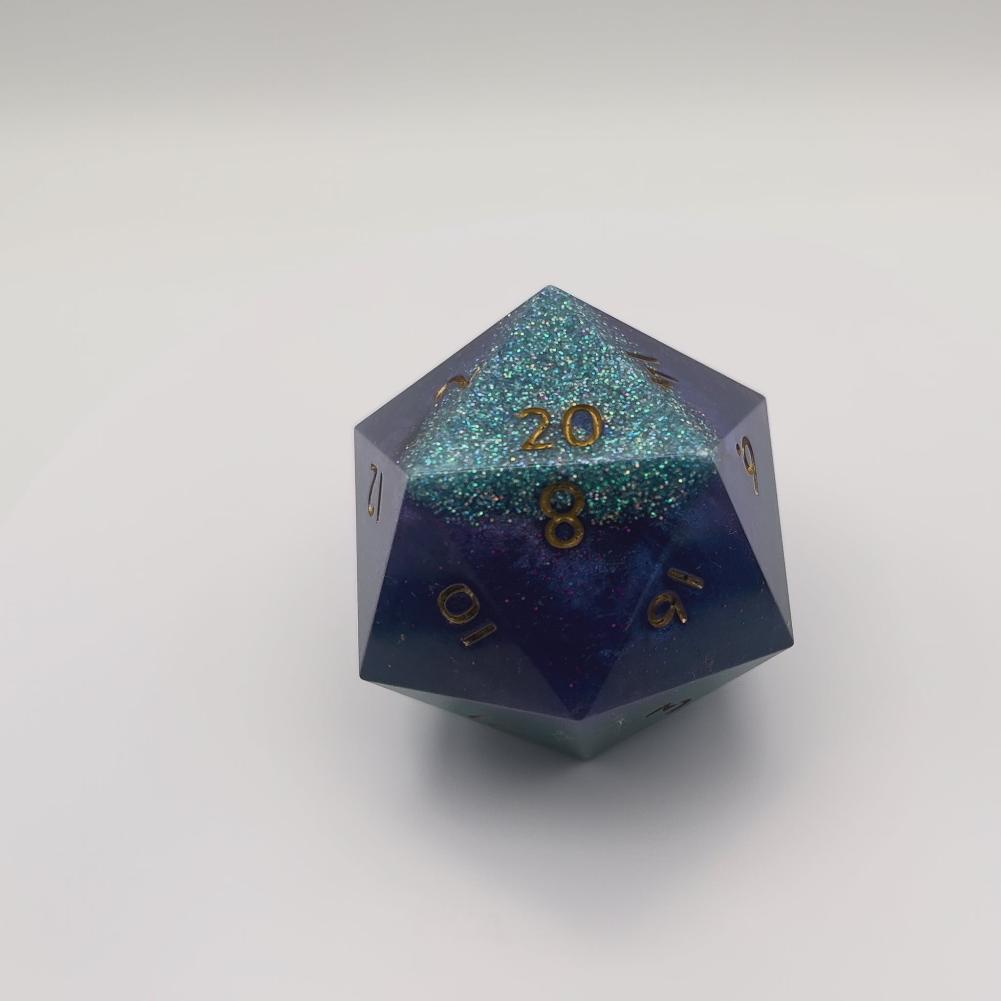 Video of D20 resin Chonk Blue, purple and green pearlescent pigment powder and iridescent super fine green glitter.