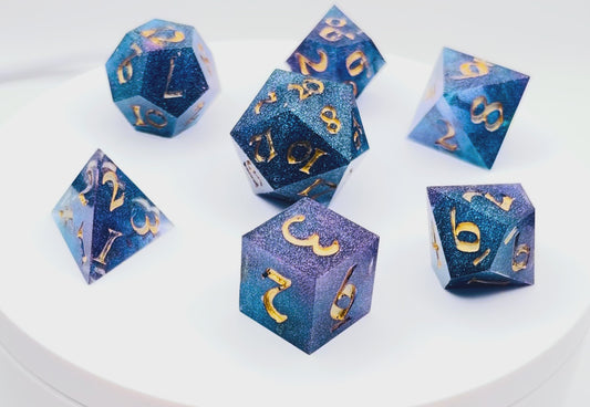 Video showing a set of 7 resin TTRPG dice Rich blue and purple semi-transparent resin with purple glitter. 