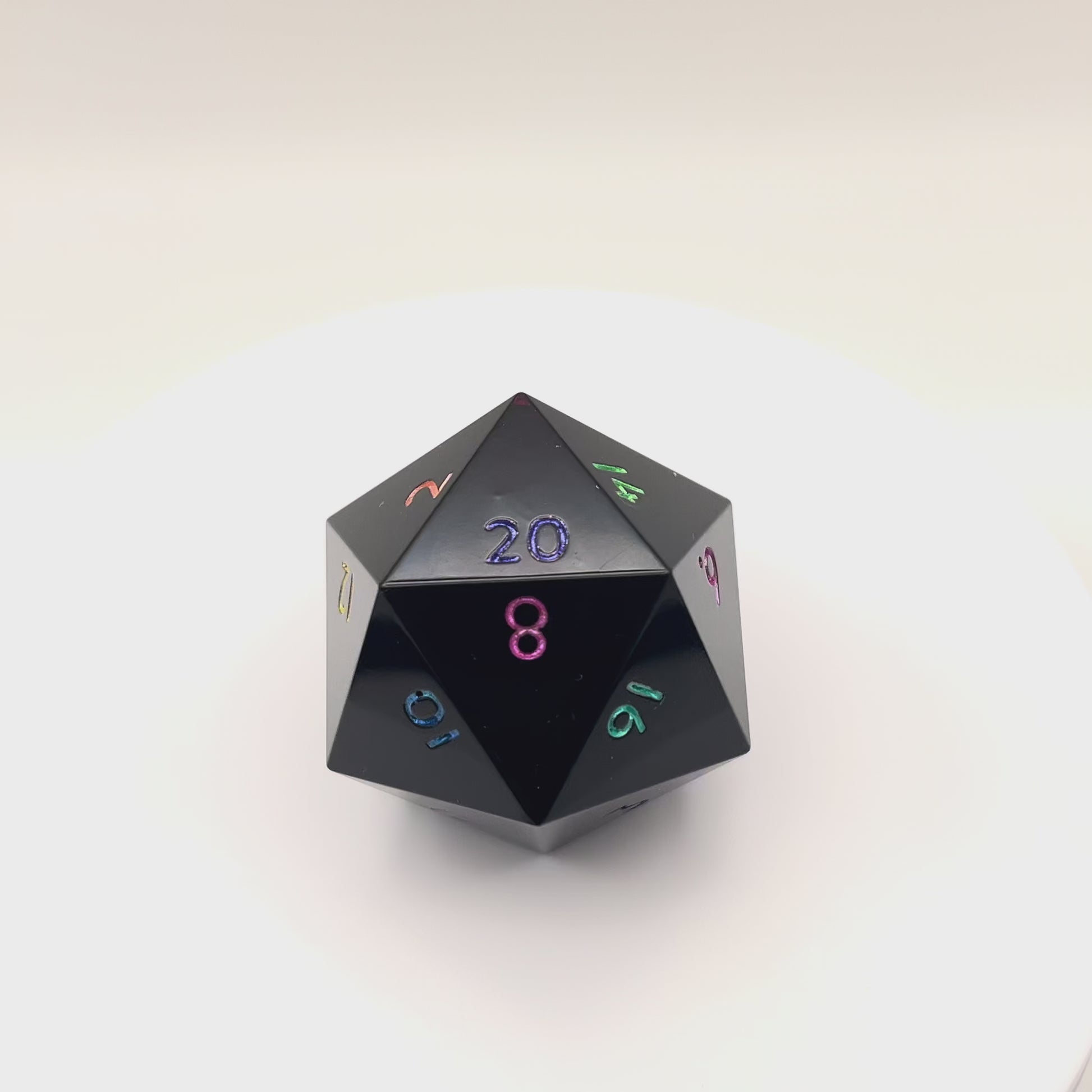 Video of Minimal Black Opaque D20 Chonk with multiple colours used for inking numbers