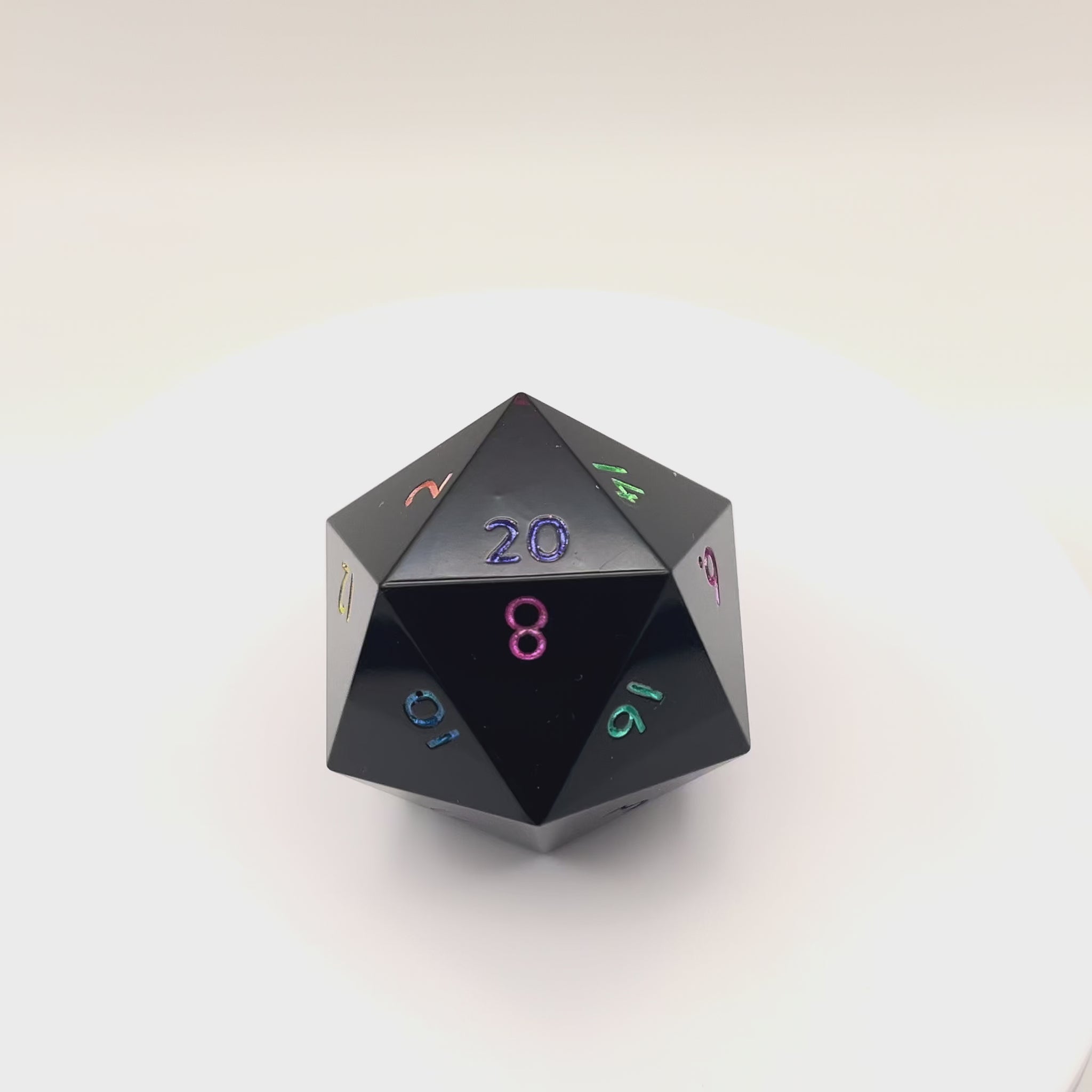 Video of Minimal Black Opaque D20 Chonk with multiple colours used for inking numbers