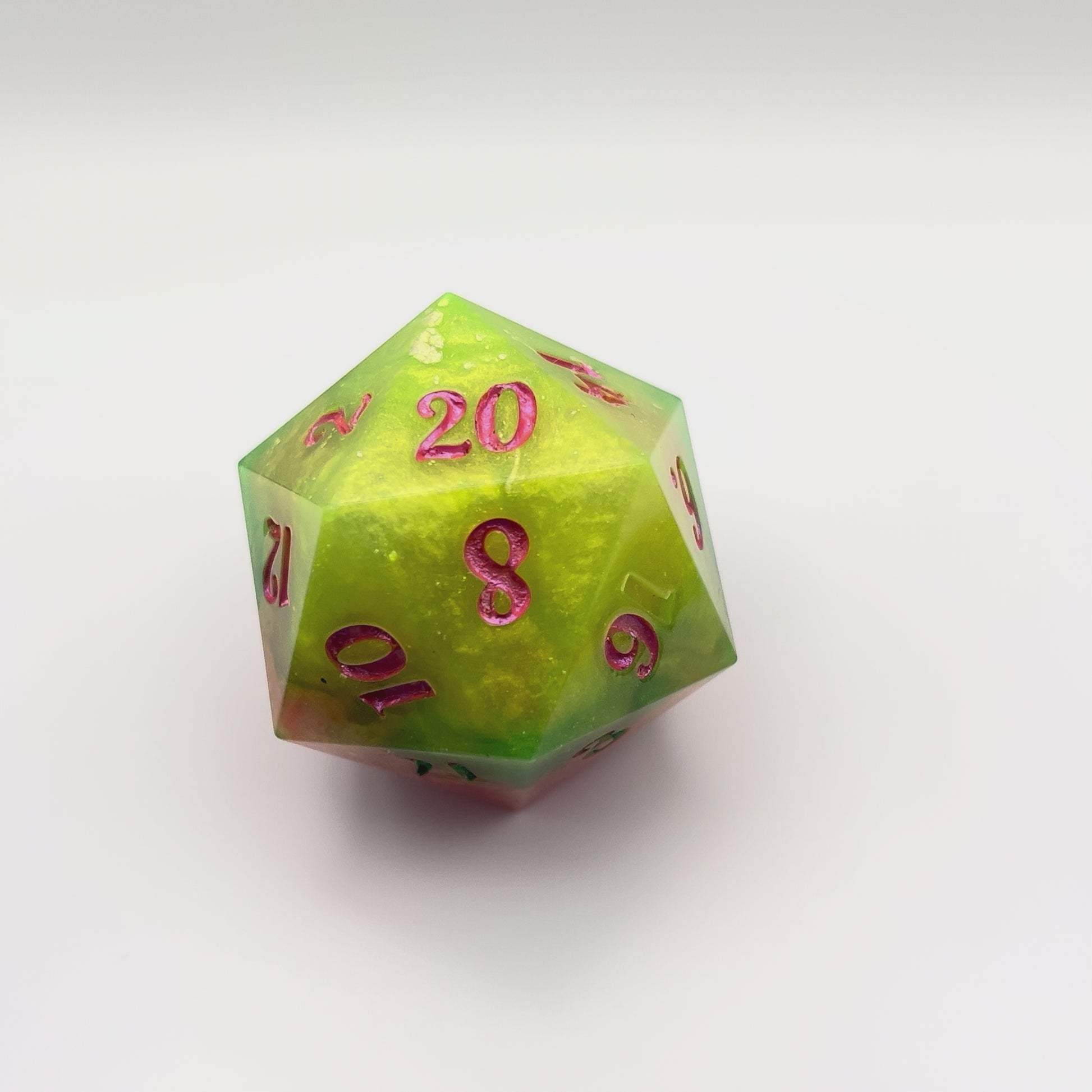 Video of Red & Green D20 chonk with red/pink  and green inking on the numbers 