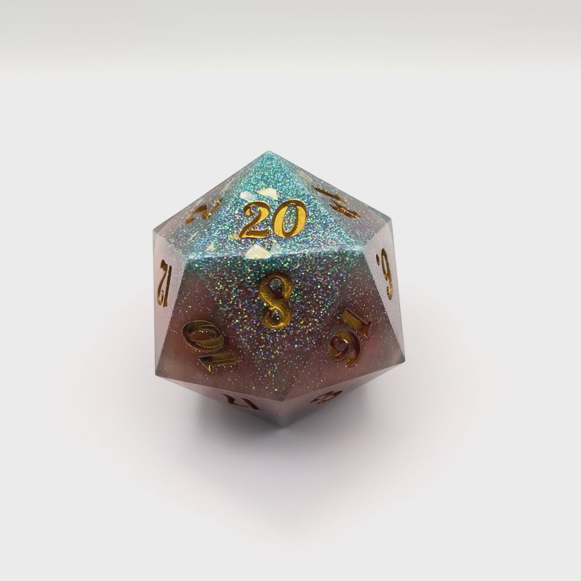 Video of D20 resin Chonk Soft pink and turquoise pearlescent pigment powder and iridescent super fine green glitter.