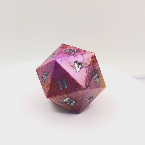 Video of opaque resin chonk coloured with gold, bronze and purple pigment powder, with tiny iridescent stars and crescent moons. Inking is in silver