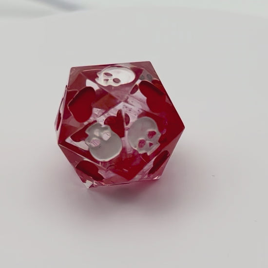Video of Blood in the water style death saves dice with white and red inking