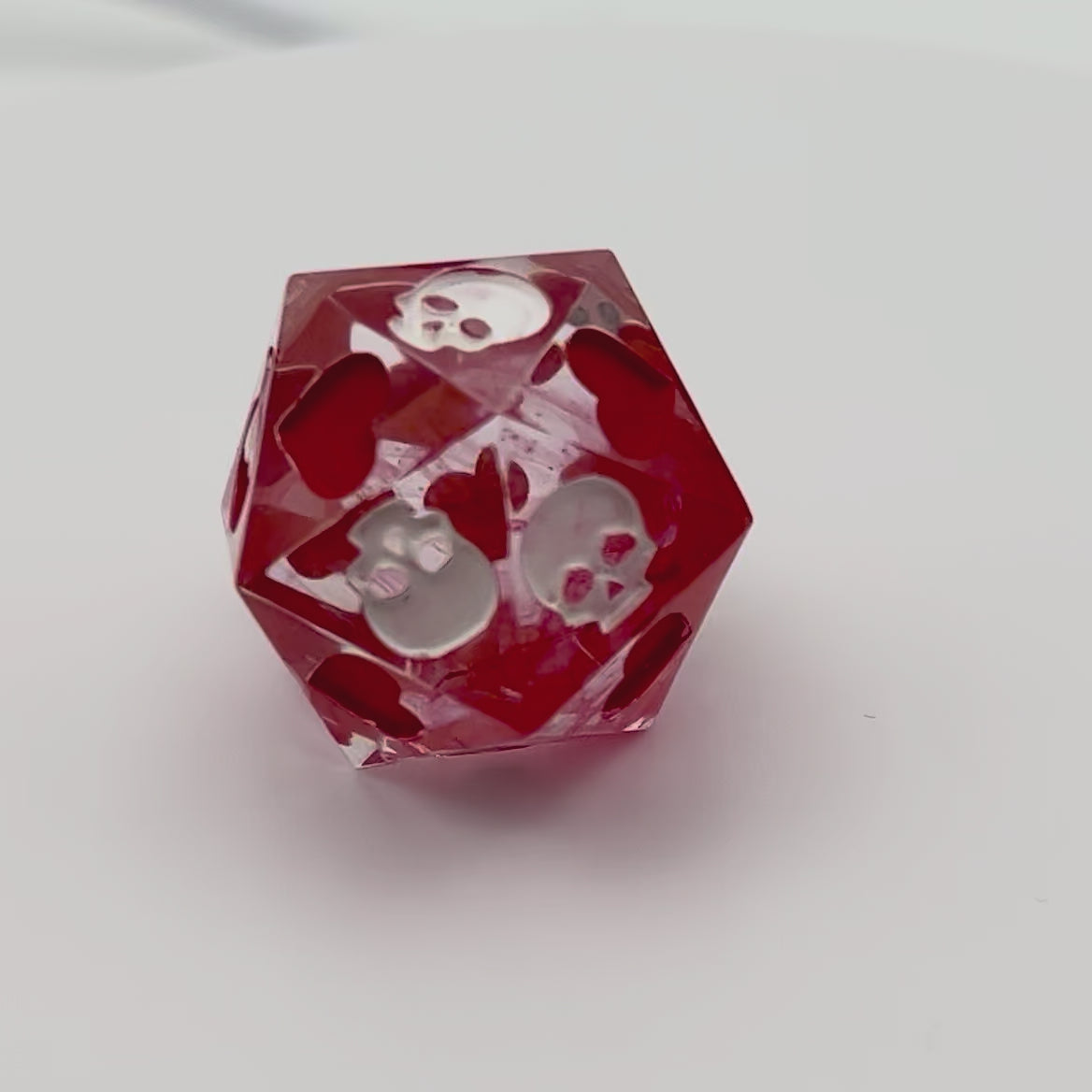 Video of Blood in the water style death saves dice with white and red inking